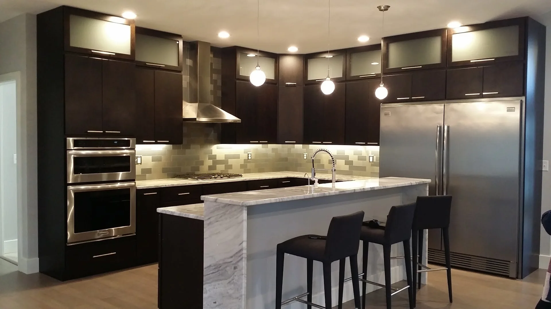 Dark galley kitchen with pendant lighting